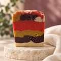 Brambleberry soap with a soft berry-toned background