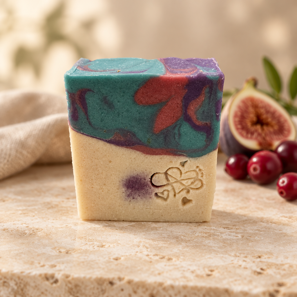 Cranberry Fig soap with a warm natural background and fruit accents