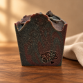 Dark Amber Rosewood soap with a warm wood-and-linen background