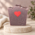 Mulberry Madness soap with a soft ivory-and-mauve background